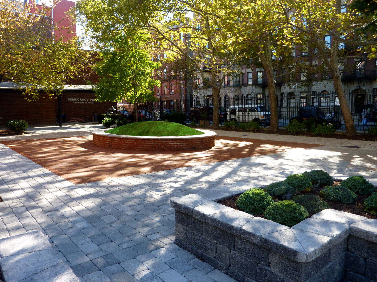 A view of a clean and lush outdoor space near buildings